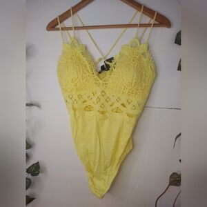 Women's Yellow Lace Deep V Neck Bodysuit with spaghetti straps.